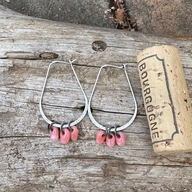 Silver hoop earrings with pink glass drops