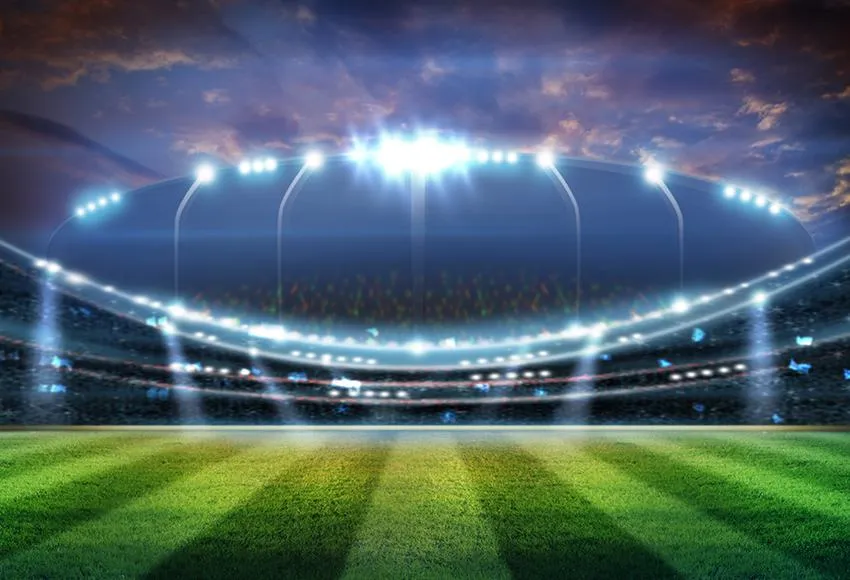 Toile de fond de terrain de football illuminé l'herbe verteM028
